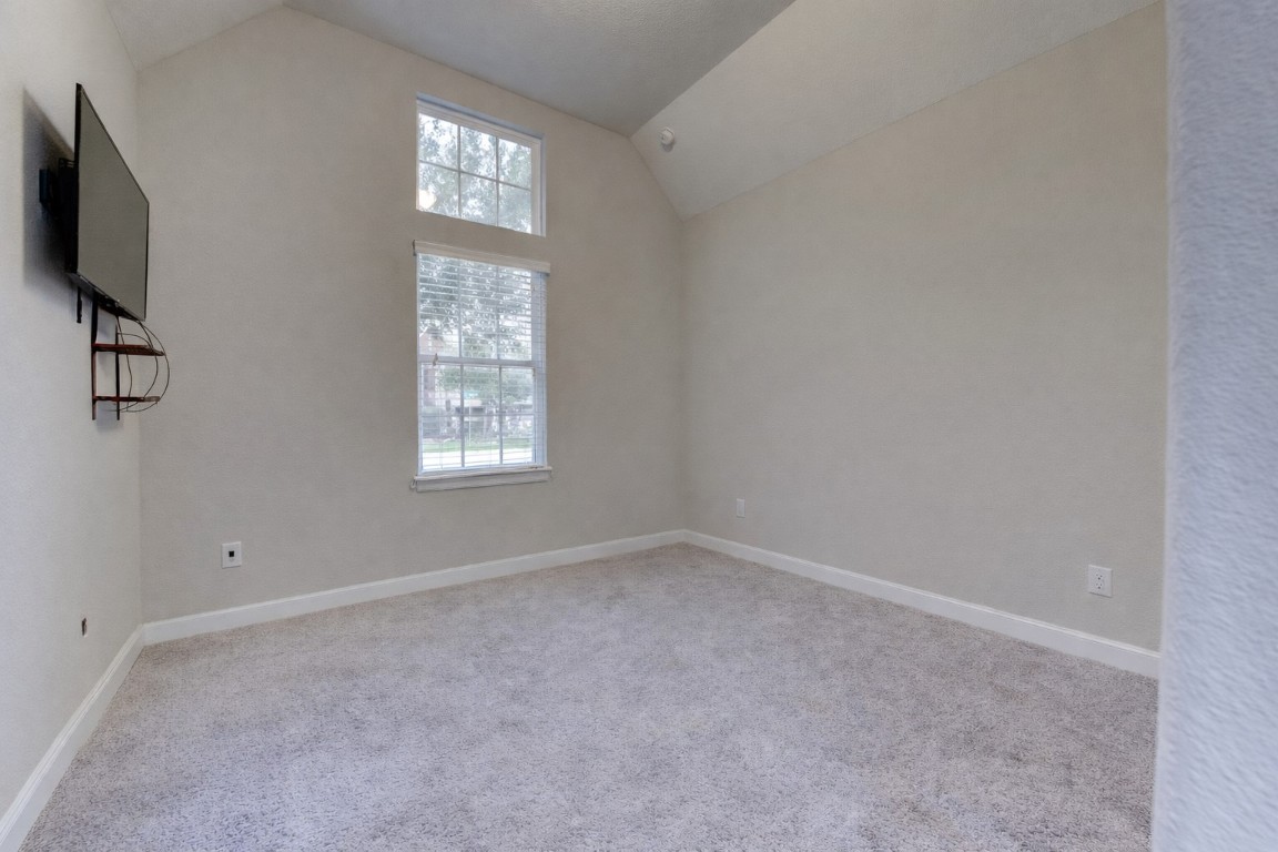 6242 Avon Landing Lane Spring, TX 77379 - Photo 29 of 42 wooden floor in an empty room with a window