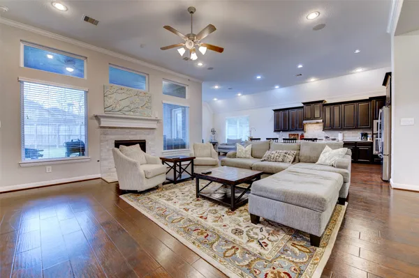 a view of a dining room with furniture and chandelier