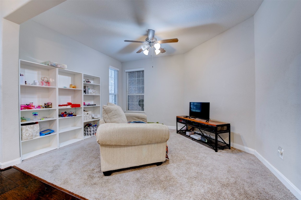 6242 Avon Landing Lane Spring, TX 77379 - Photo 32 of 42 a living room with furniture and a chandelier