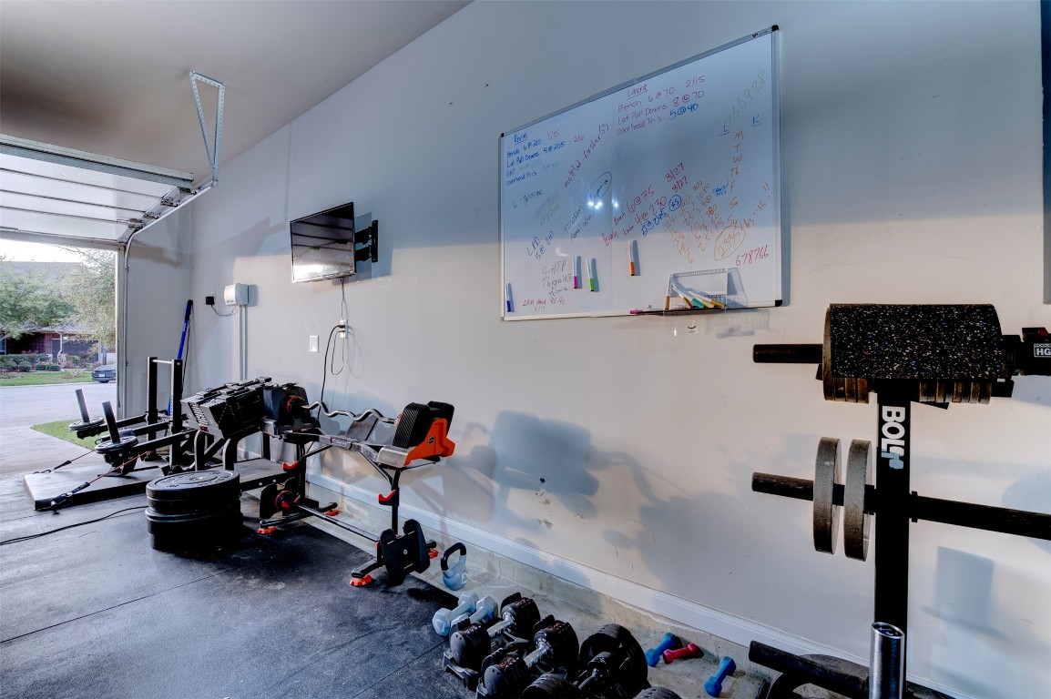 6242 Avon Landing Lane Spring, TX 77379 - Photo 39 of 42 a room with gym equipment and equipment