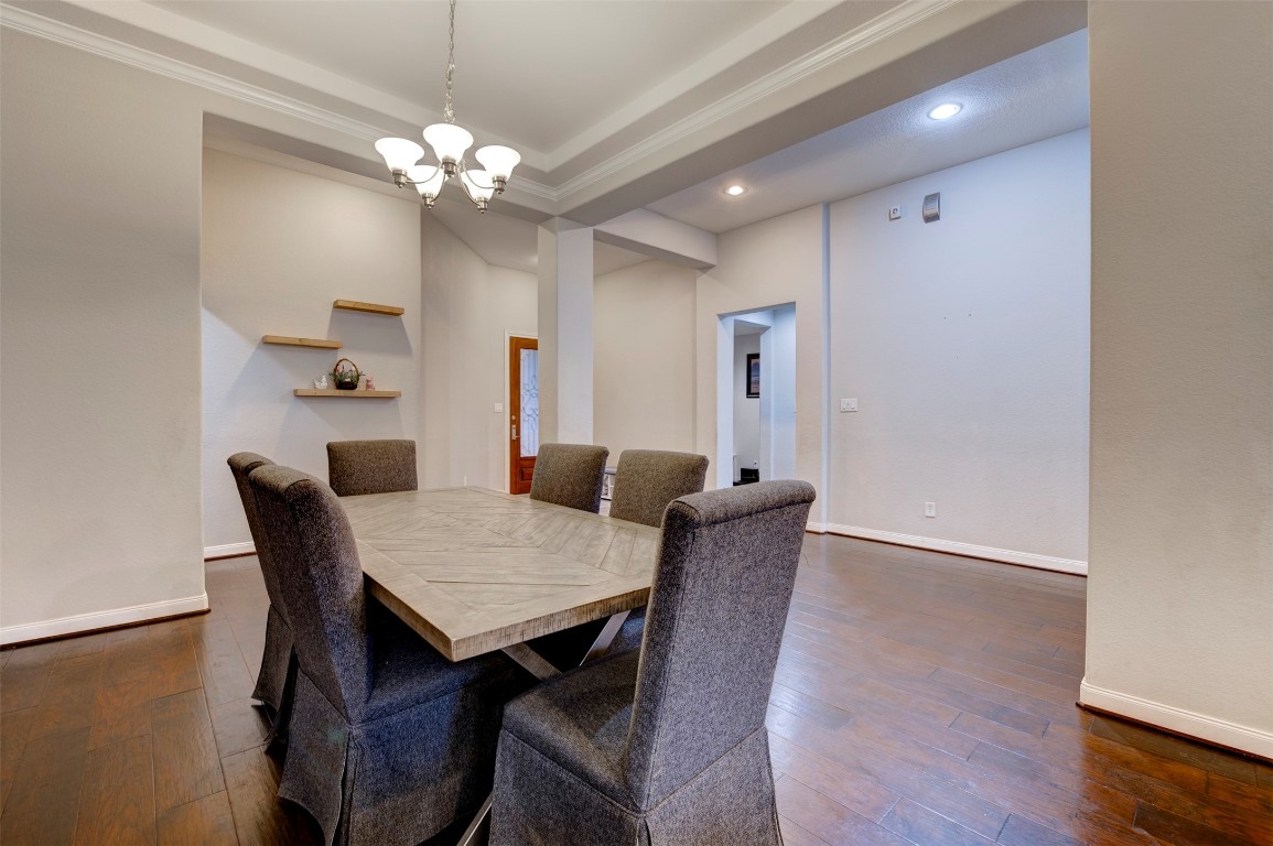 6242 Avon Landing Lane Spring, TX 77379 - Photo 8 of 42 a view of a dining room with furniture and chandelier