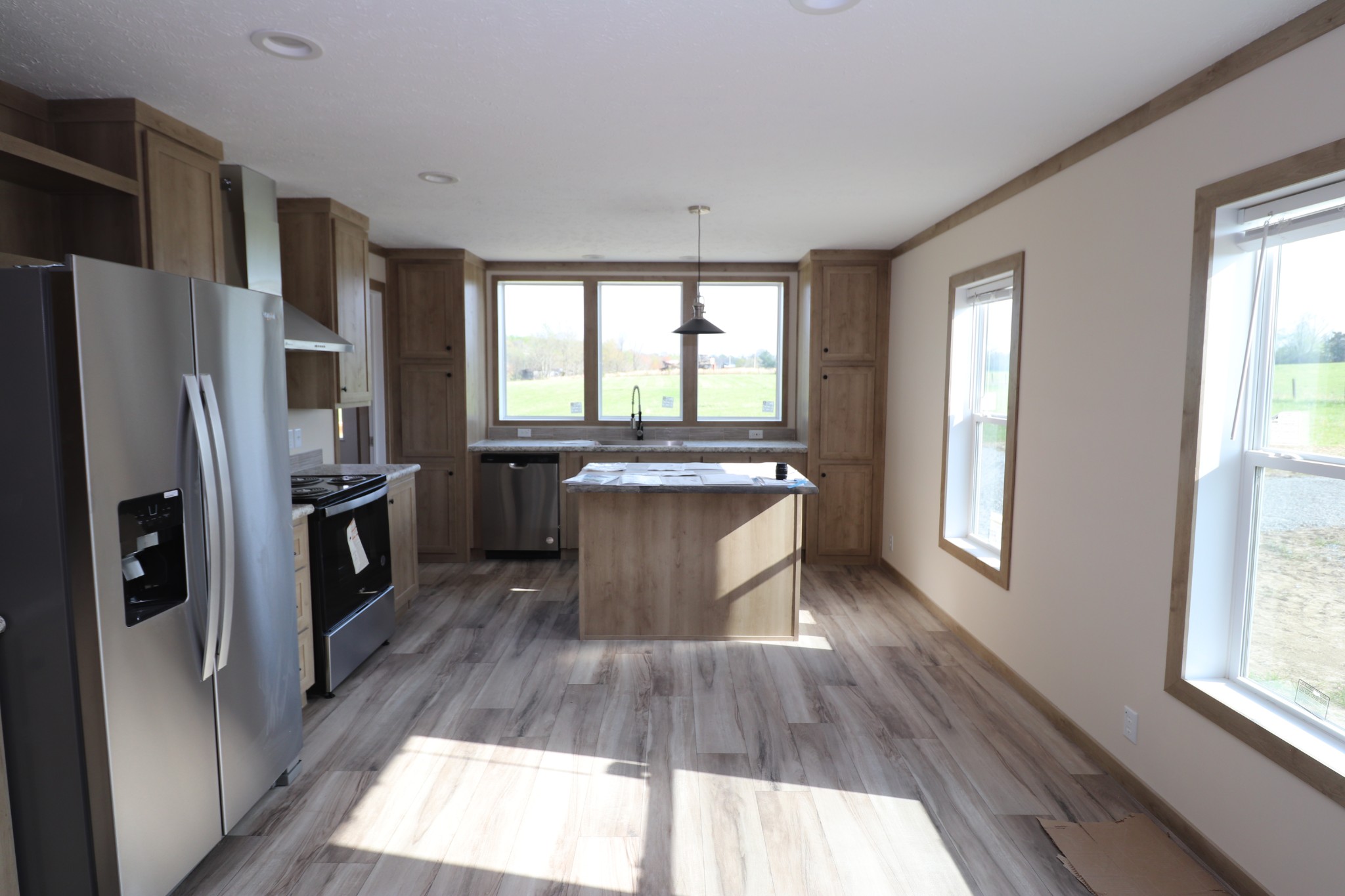 780 Nixon Road Red Boiling Springs, TN 37150 - Photo 6 of 25 a kitchen with stainless steel appliances granite countertop a refrigerator a sink a stove and oven