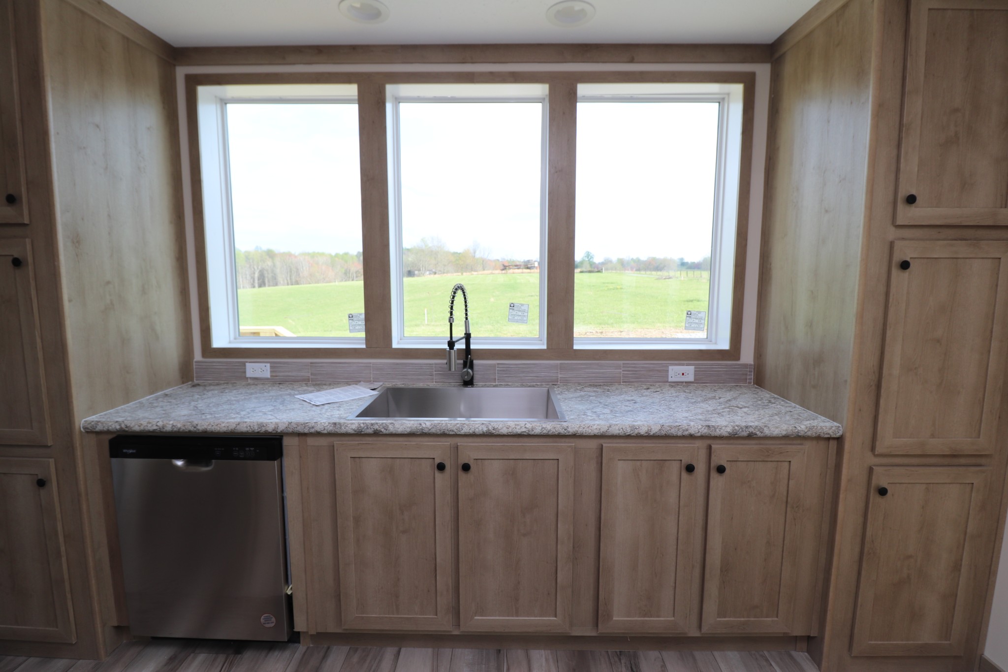 780 Nixon Road Red Boiling Springs, TN 37150 - Photo 8 of 25 a kitchen with a granite countertop sink and window