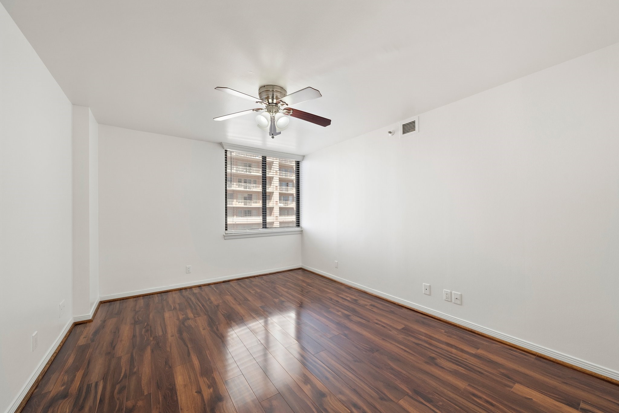 3525 Sage Road, Unit 613 Houston, TX 77056 - Photo 17 of 21 wooden floor in an empty room with a window