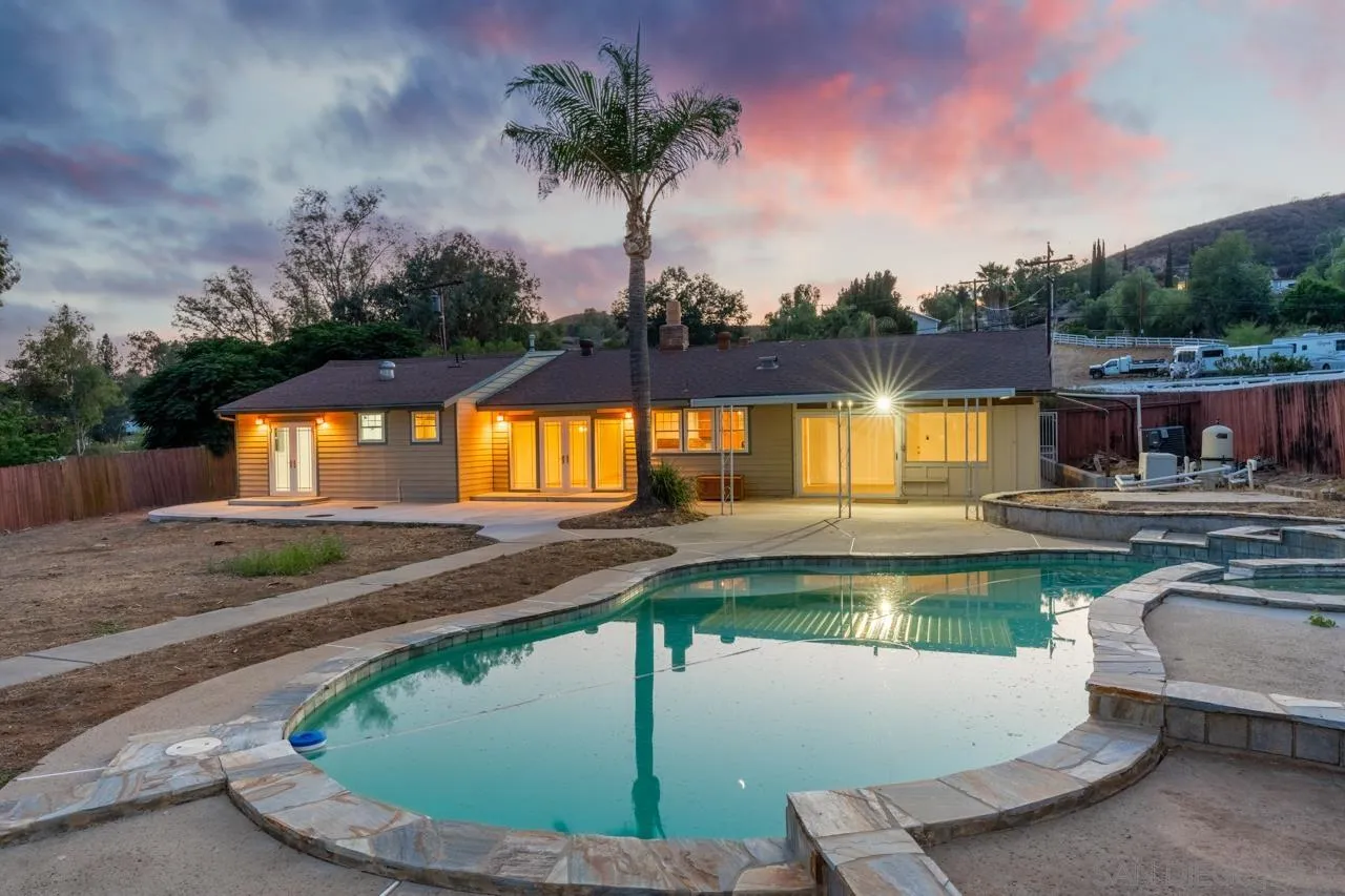 a view of a swimming pool with a patio
