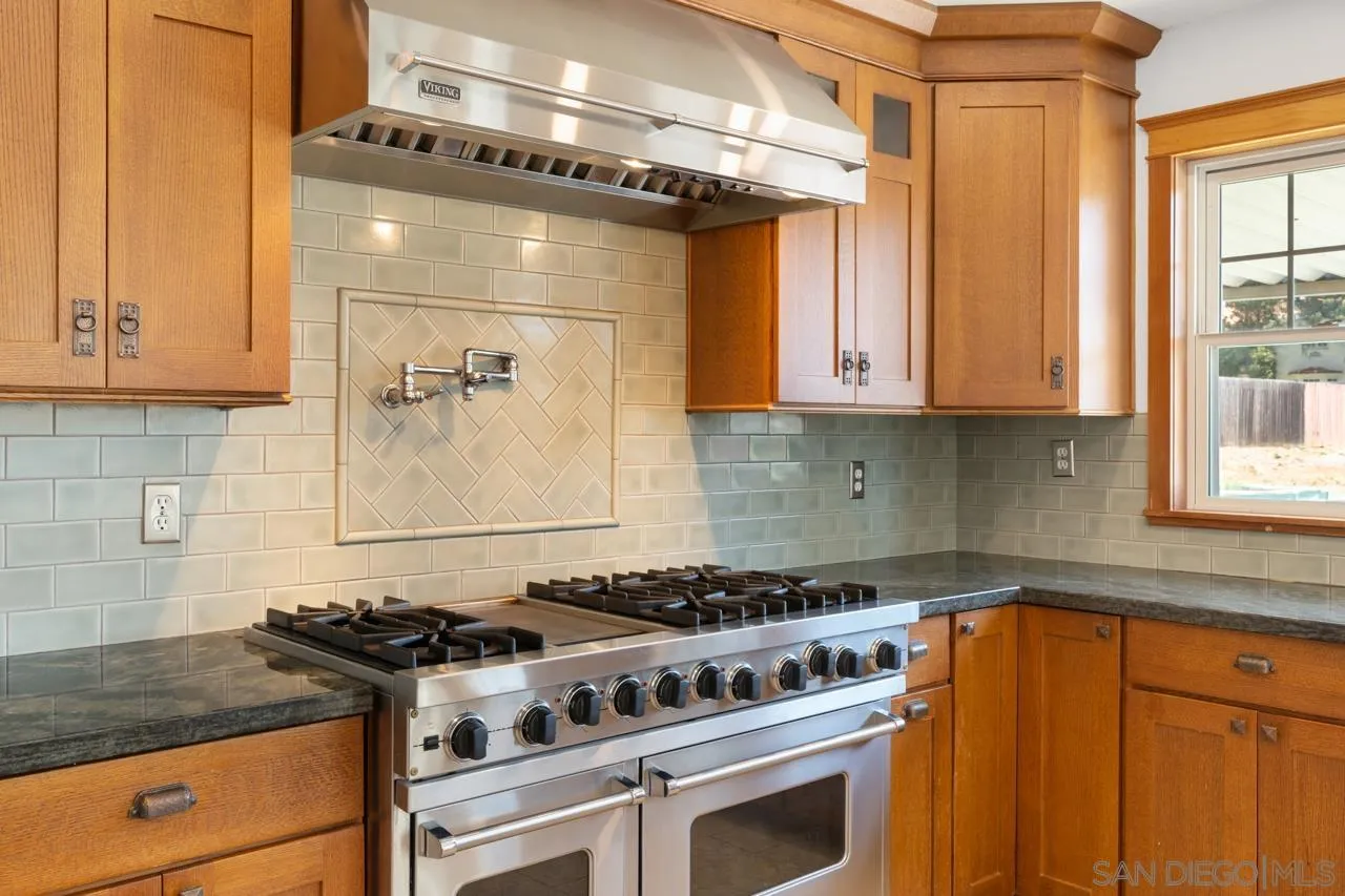 11823 Rocoso Road Lakeside, CA 92040 - Photo 16 of 48 a stove top oven sitting inside of a kitchen