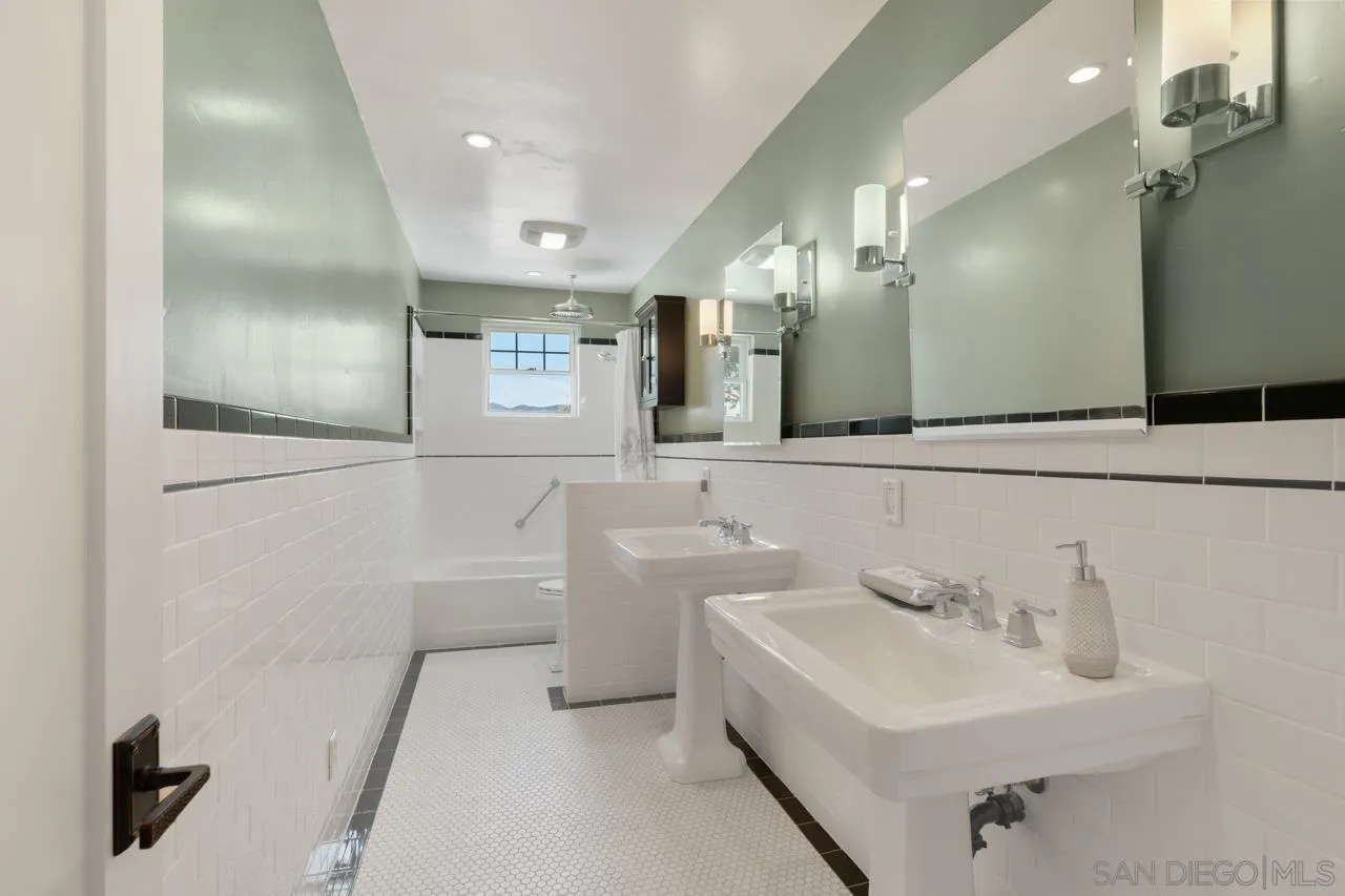 11823 Rocoso Road Lakeside, CA 92040 - Photo 21 of 48 a bathroom with a sink a toilet and a mirror