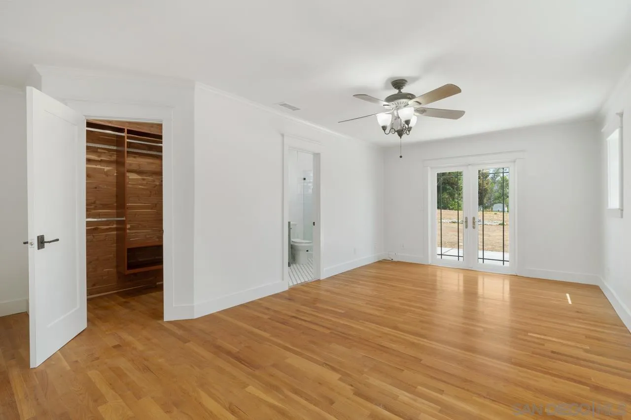 11823 Rocoso Road Lakeside, CA 92040 - Photo 24 of 48 a view of an empty room with a window and a kitchen