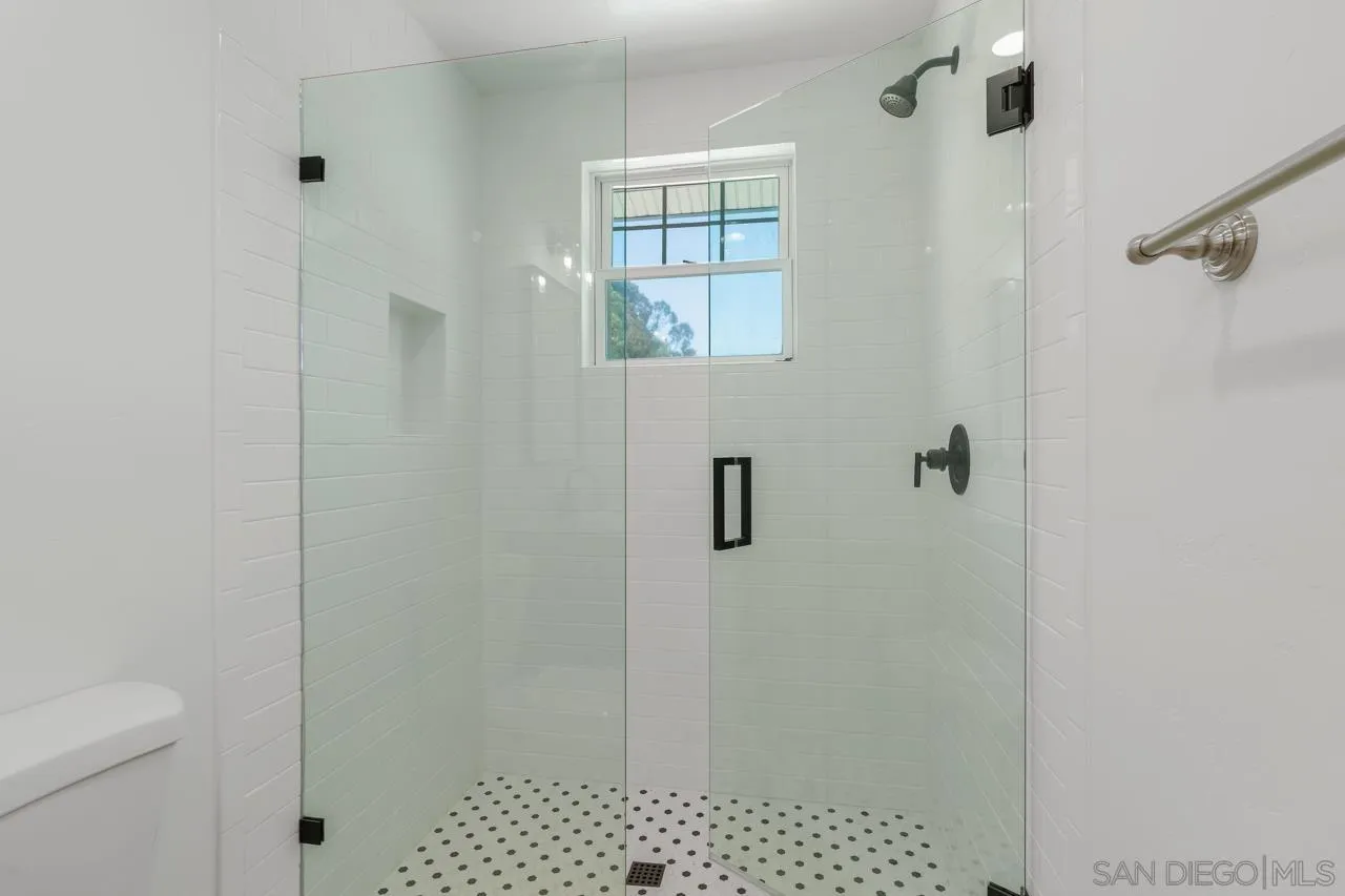 11823 Rocoso Road Lakeside, CA 92040 - Photo 27 of 48 a bathroom with a shower and a toilet
