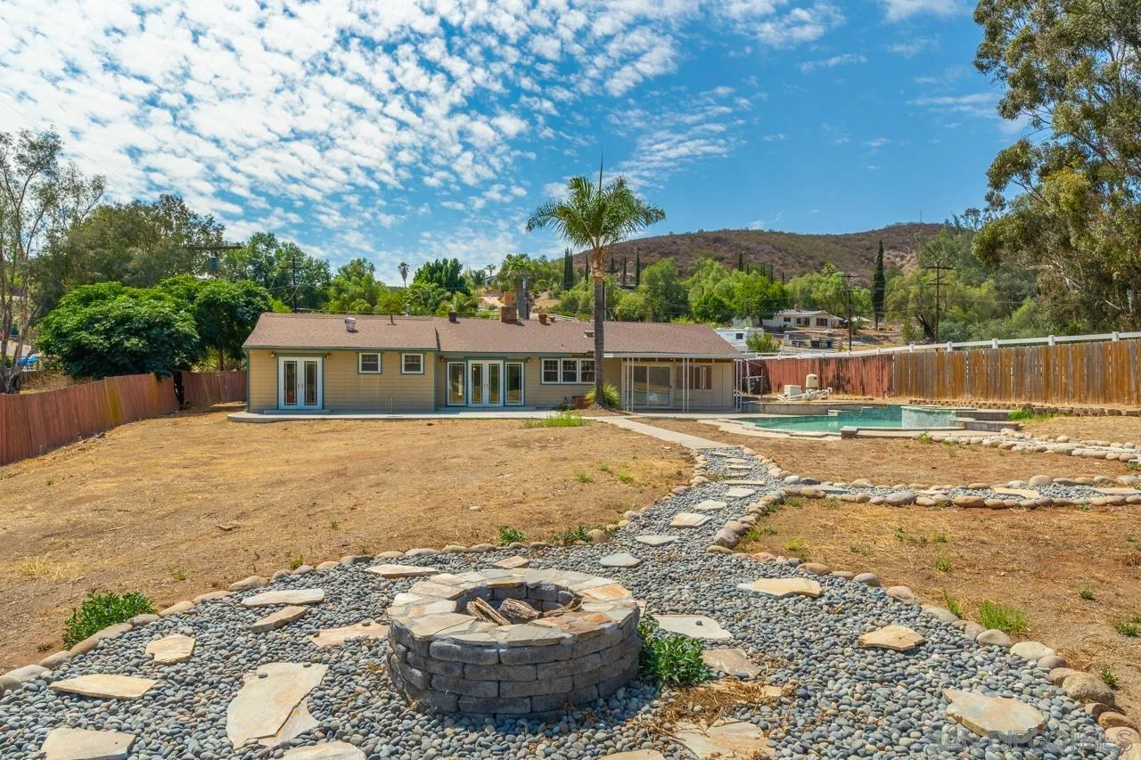 11823 Rocoso Road Lakeside, CA 92040 - Photo 38 of 48 a house with swimming pool in front of it