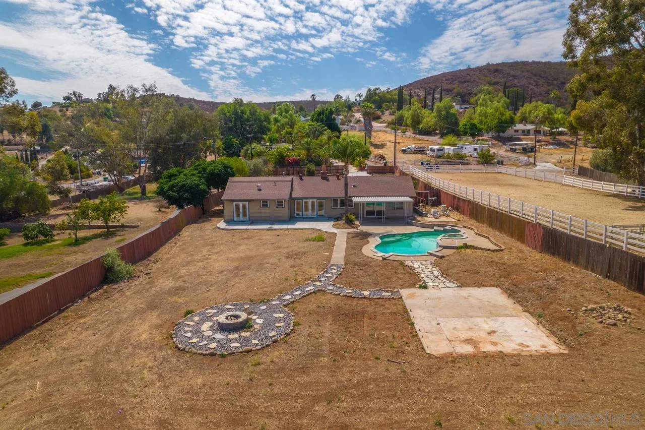 11823 Rocoso Road Lakeside, CA 92040 - Photo 39 of 48 a view of a swimming pool with a yard