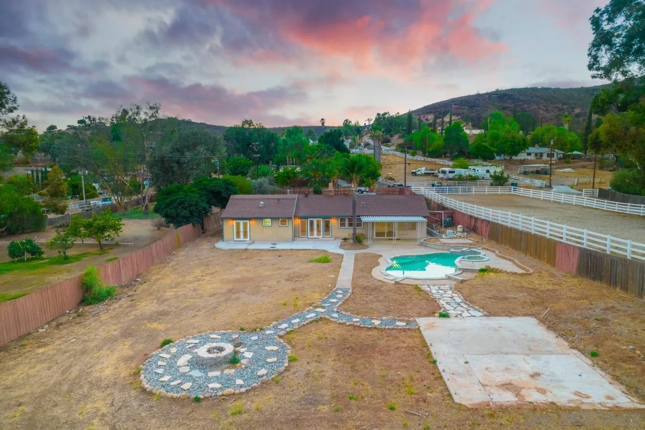 11823 Rocoso Road Lakeside, CA 92040 - Photo 41 of 48 a view of a swimming pool with a yard
