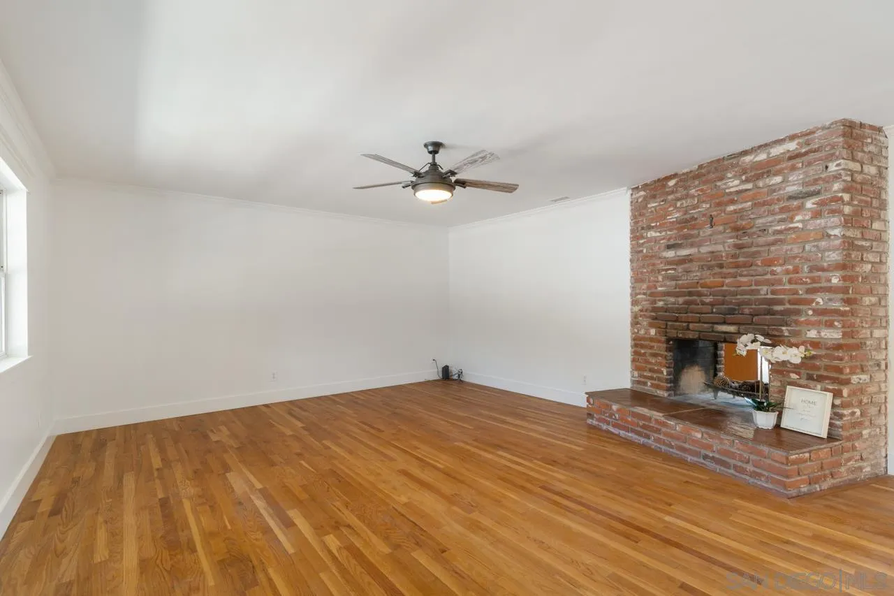 11823 Rocoso Road Lakeside, CA 92040 - Photo 8 of 48 a bedroom with a bed and a ceiling fan