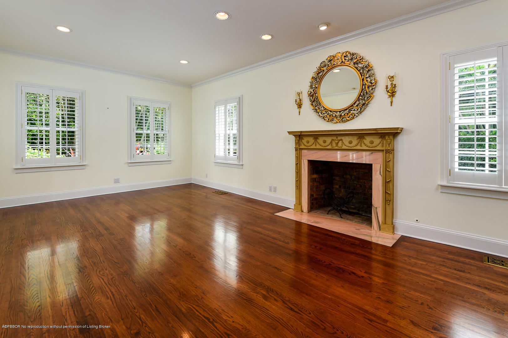 142 South County Road Palm Beach, FL 33480 - Photo 2 of 12 a view of an empty room with wooden floor and a fireplace