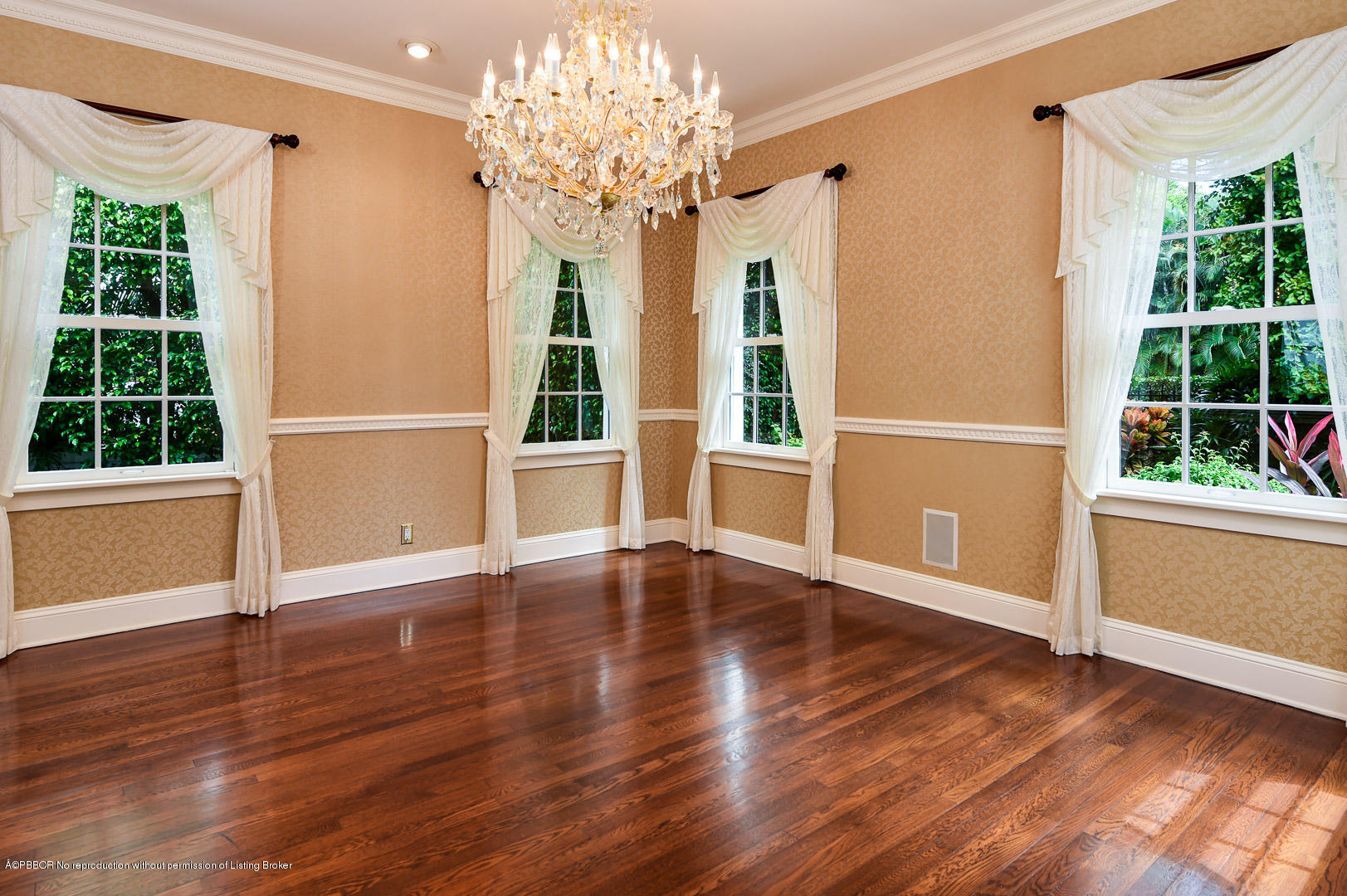 142 South County Road Palm Beach, FL 33480 - Photo 3 of 12 a view of an empty room with wooden floor and a window