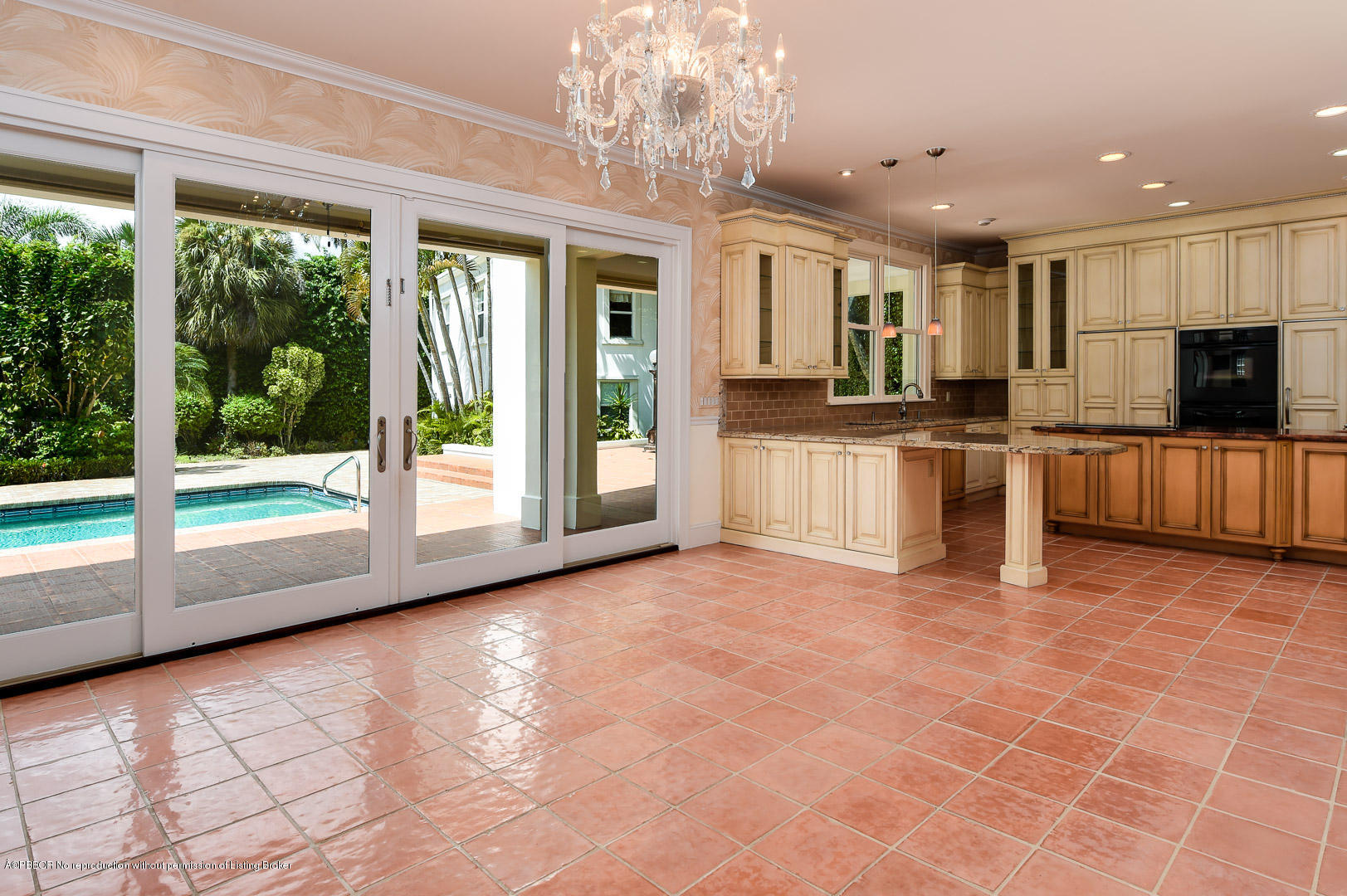 142 South County Road Palm Beach, FL 33480 - Photo 5 of 12 a view of a kitchen with stainless steel appliances granite countertop a large counter top and a view of living room