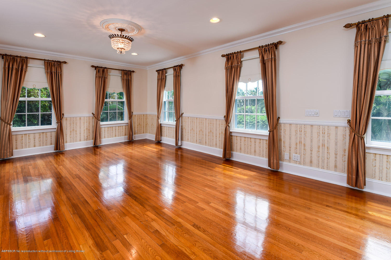 142 South County Road Palm Beach, FL 33480 - Photo 6 of 12 a view of an empty room with wooden floor and a window