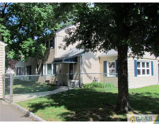 43 South Hill Road Colonia, NJ 07067 - Photo 22 of 25 a front view of a house with a yard and potted plants