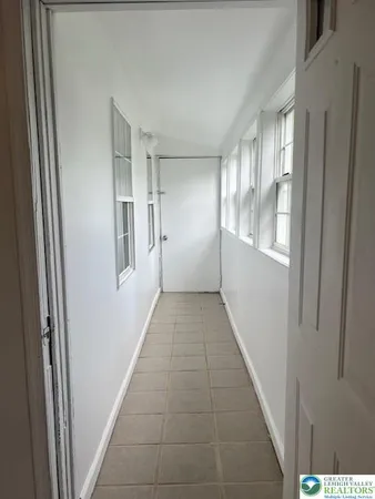 a view of hallway with windows