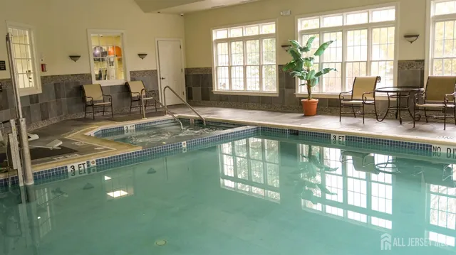 a wooden bench sitting in front of a house