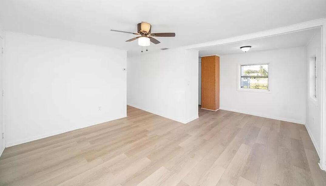 1520 Hunter Road Okeechobee, FL 34974 - Photo 14 of 20 a view of empty room with wooden floor