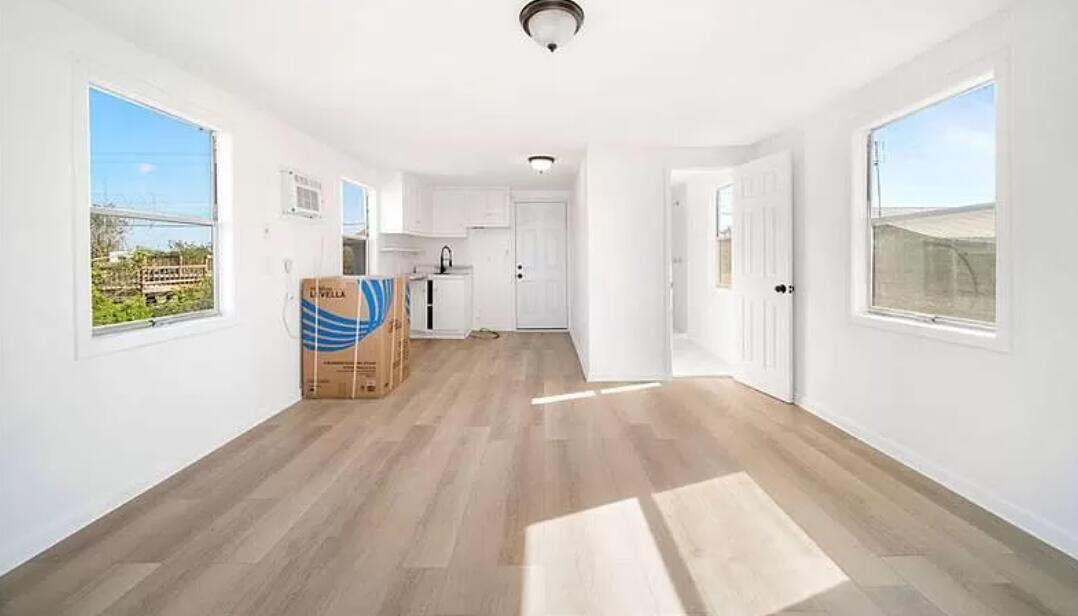 1520 Hunter Road Okeechobee, FL 34974 - Photo 6 of 20 a view of kitchen with furniture and wooden floor