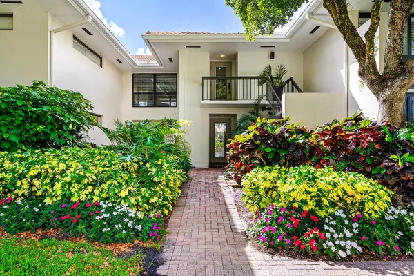 an aerial view of a house with yard swimming pool and outdoor seating
