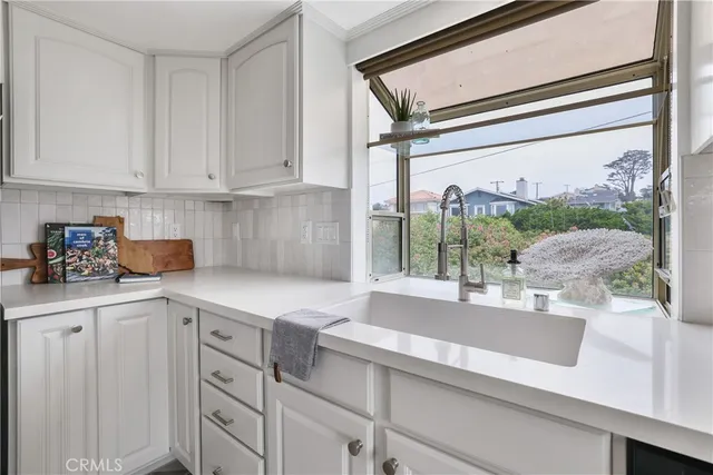 a view of a dining room with furniture and window