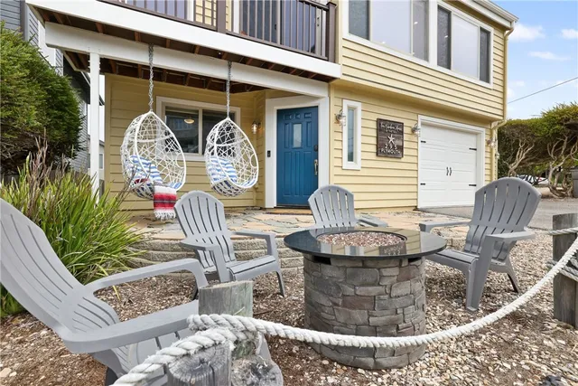 a building outdoor space with patio furniture and potted plants