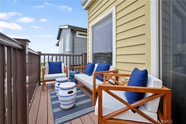a living room with furniture a couch and painting on the wall
