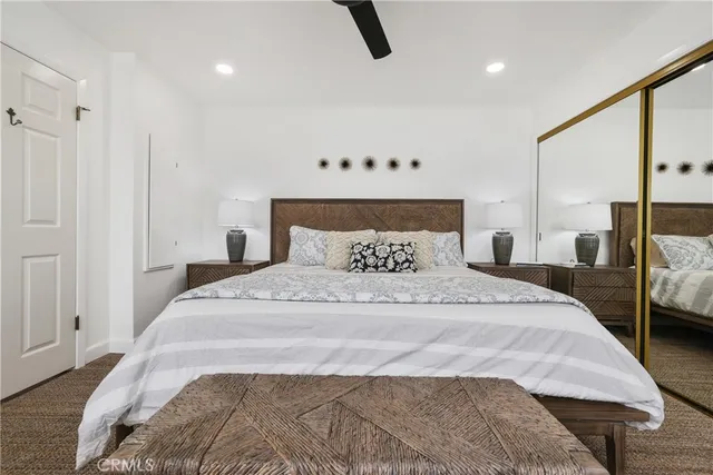 a bedroom with a bed and lamp