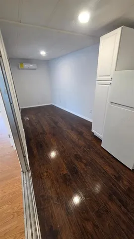 a view of kitchen and wooden floor