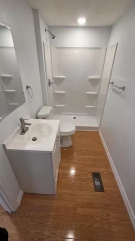 a bathroom with a sink and mirror