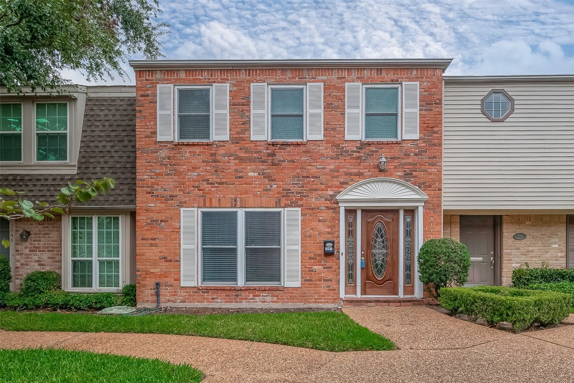 a front view of a house having yard
