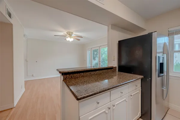 a view of kitchen island with wooden floor
