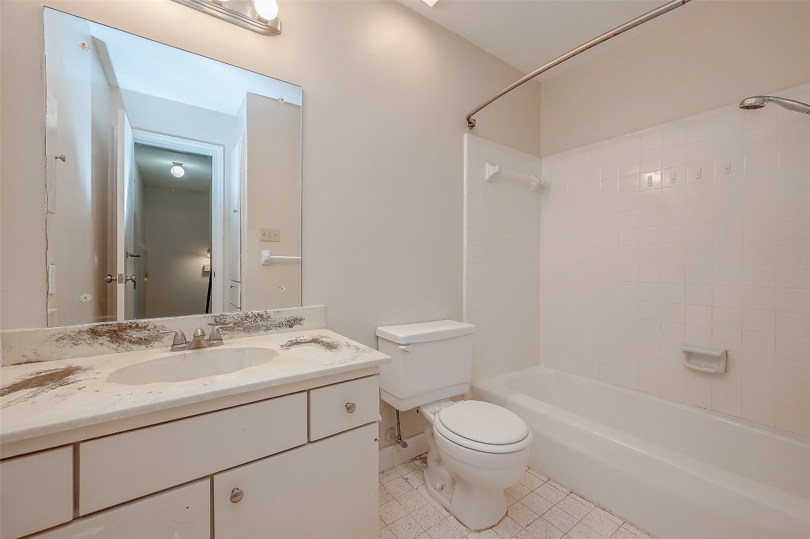 2047 Winrock Boulevard, Unit 61 Houston, TX 77057 - Photo 27 of 50 a bathroom with a sink a toilet and shower