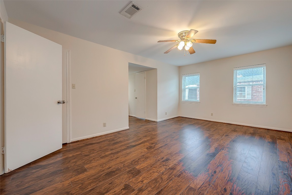 2047 Winrock Boulevard, Unit 61 Houston, TX 77057 - Photo 28 of 50 a view of an empty room with wooden floor and a window