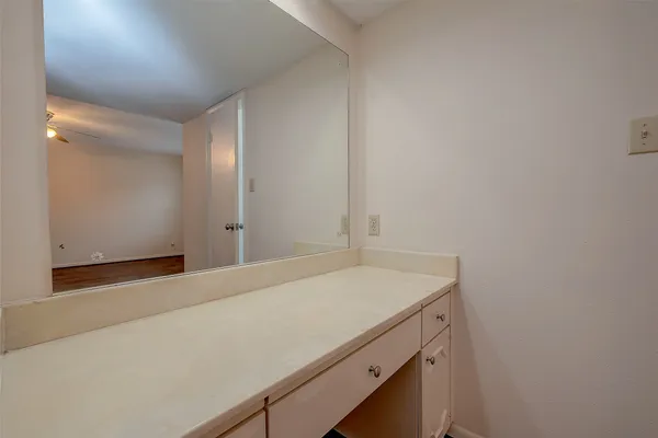 a bathroom with a sink and vanity