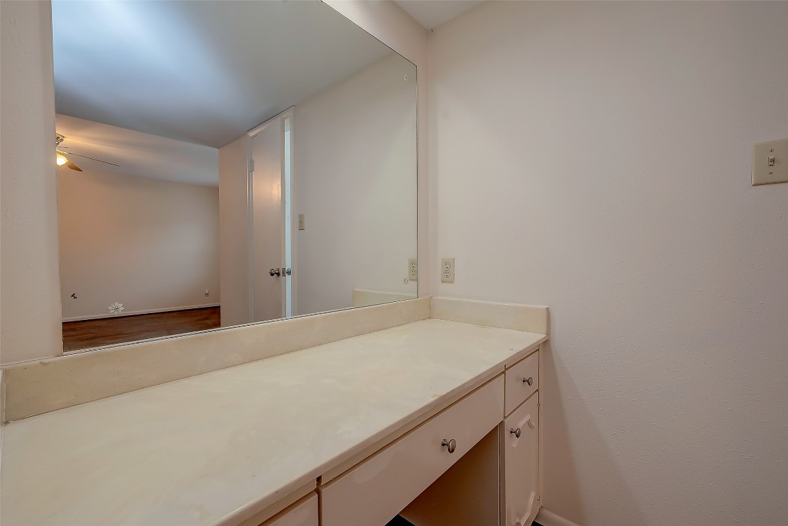 2047 Winrock Boulevard, Unit 61 Houston, TX 77057 - Photo 30 of 50 a bathroom with a sink and vanity