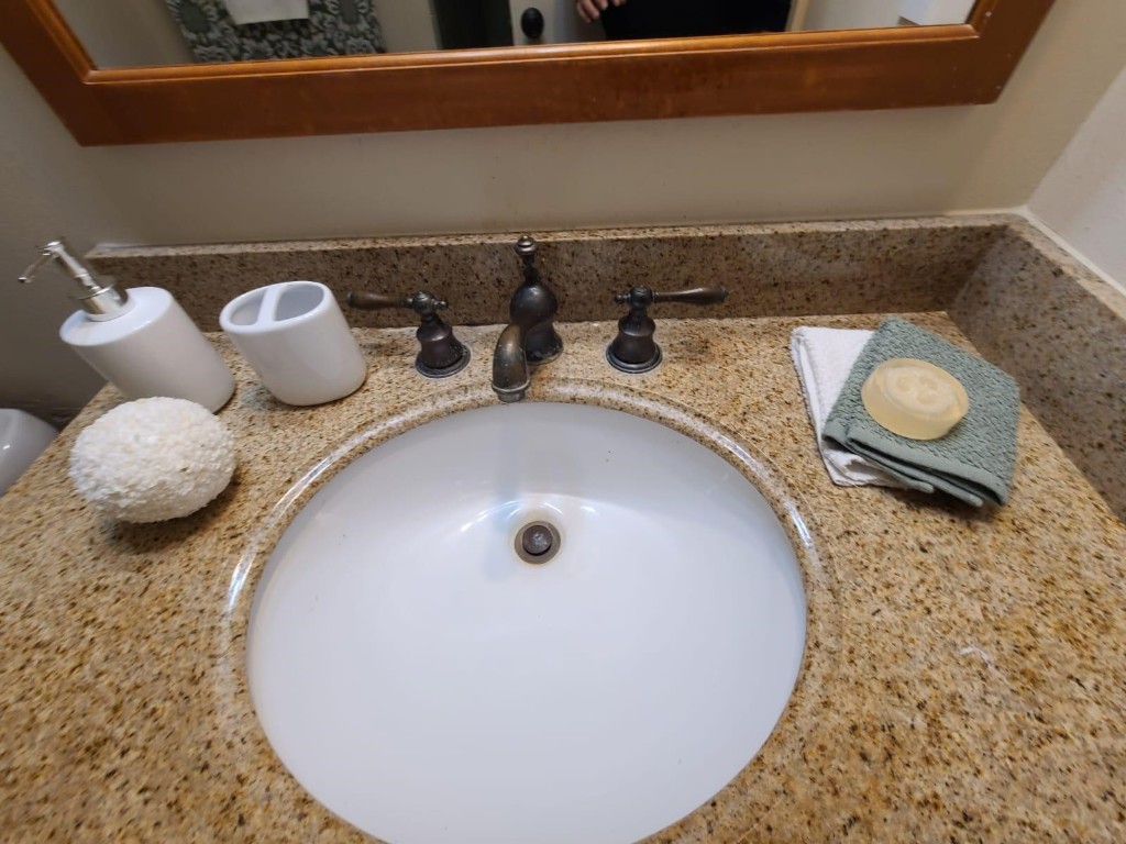 2047 Winrock Boulevard, Unit 61 Houston, TX 77057 - Photo 33 of 50 a bathroom with a granite countertop sink