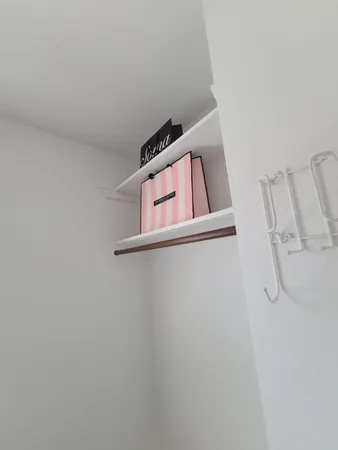 a view of a room with rack on the wall