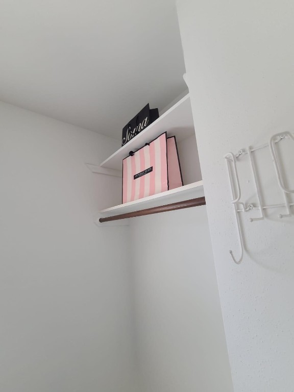 2047 Winrock Boulevard, Unit 61 Houston, TX 77057 - Photo 44 of 50 a view of a room with rack on the wall