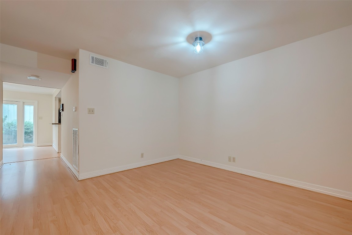 2047 Winrock Boulevard, Unit 61 Houston, TX 77057 - Photo 6 of 50 wooden floor in an empty room