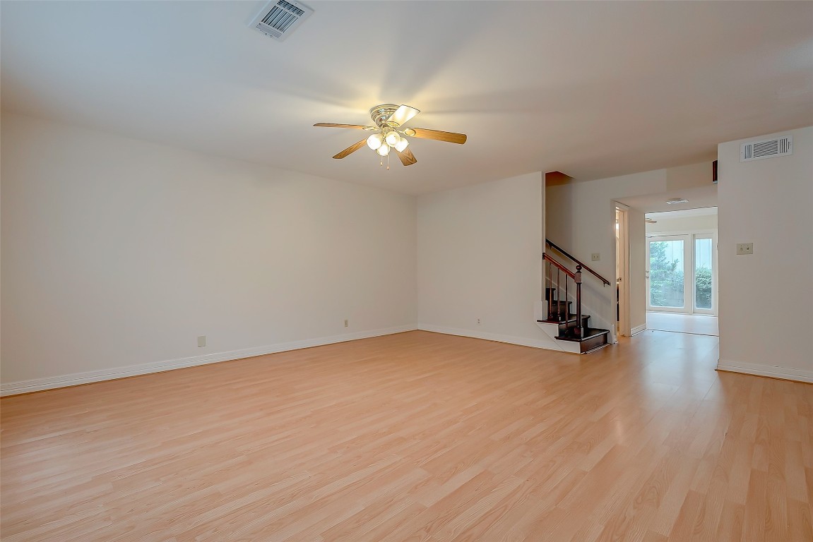 2047 Winrock Boulevard, Unit 61 Houston, TX 77057 - Photo 8 of 50 a view of empty room with wooden floor