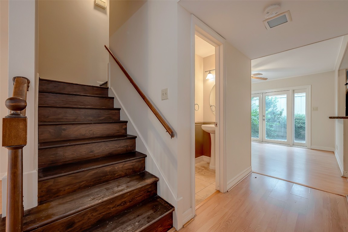 2047 Winrock Boulevard, Unit 61 Houston, TX 77057 - Photo 9 of 50 a view of entryway and hall with wooden floor