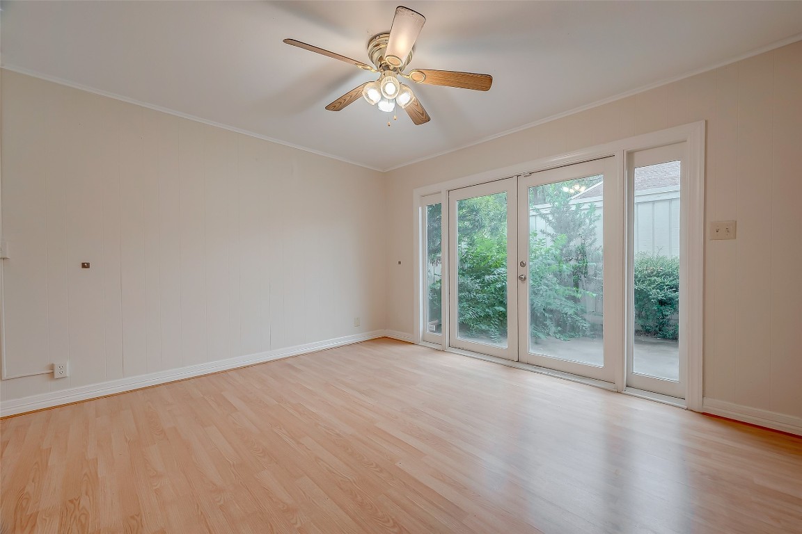 2047 Winrock Boulevard, Unit 61 Houston, TX 77057 - Photo 10 of 50 wooden floor in an empty room with a window
