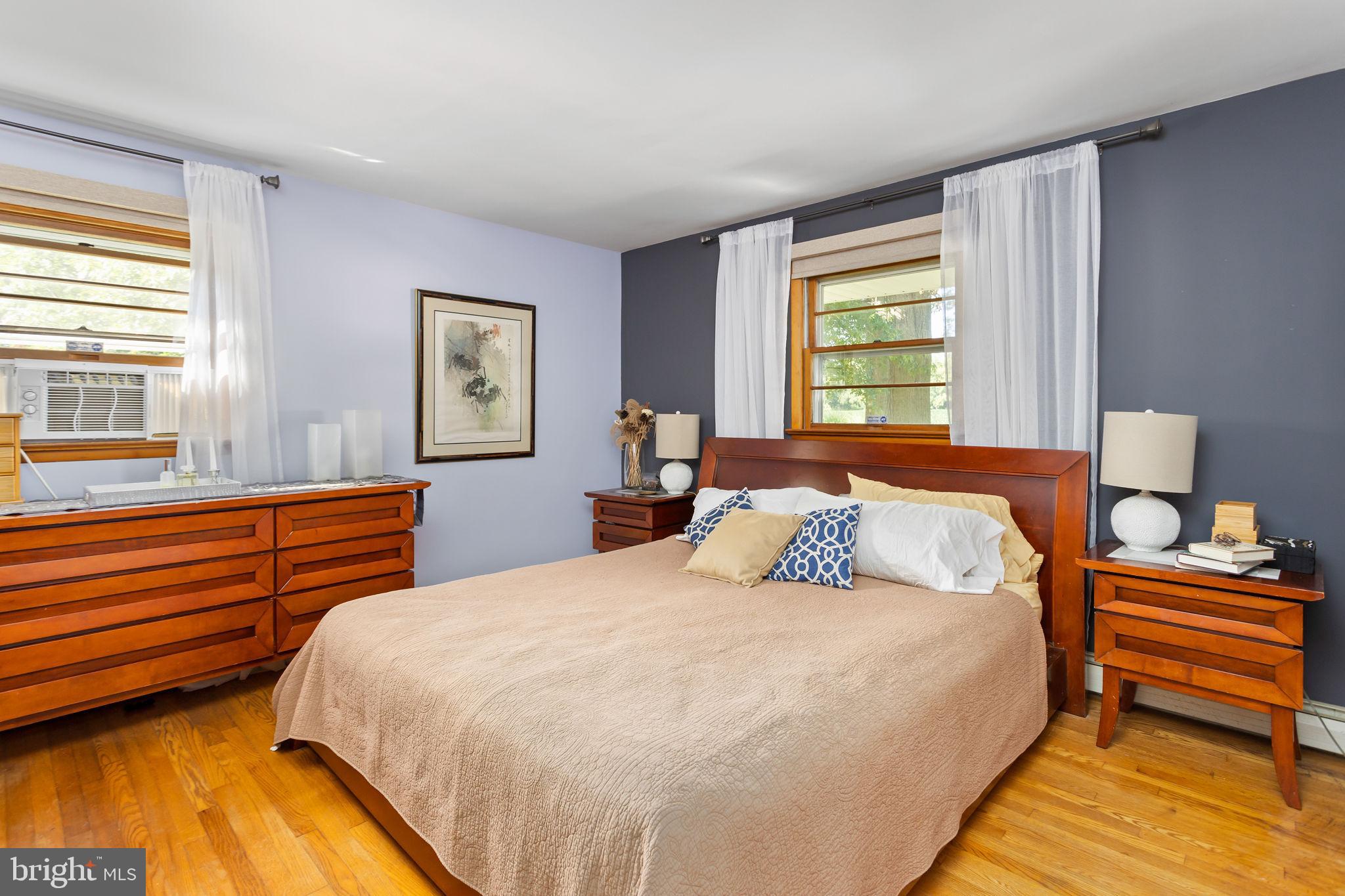 415 Ellisdale Road Chesterfield, NJ 08515 - Photo 20 of 47 a bedroom with a bed and wooden floor