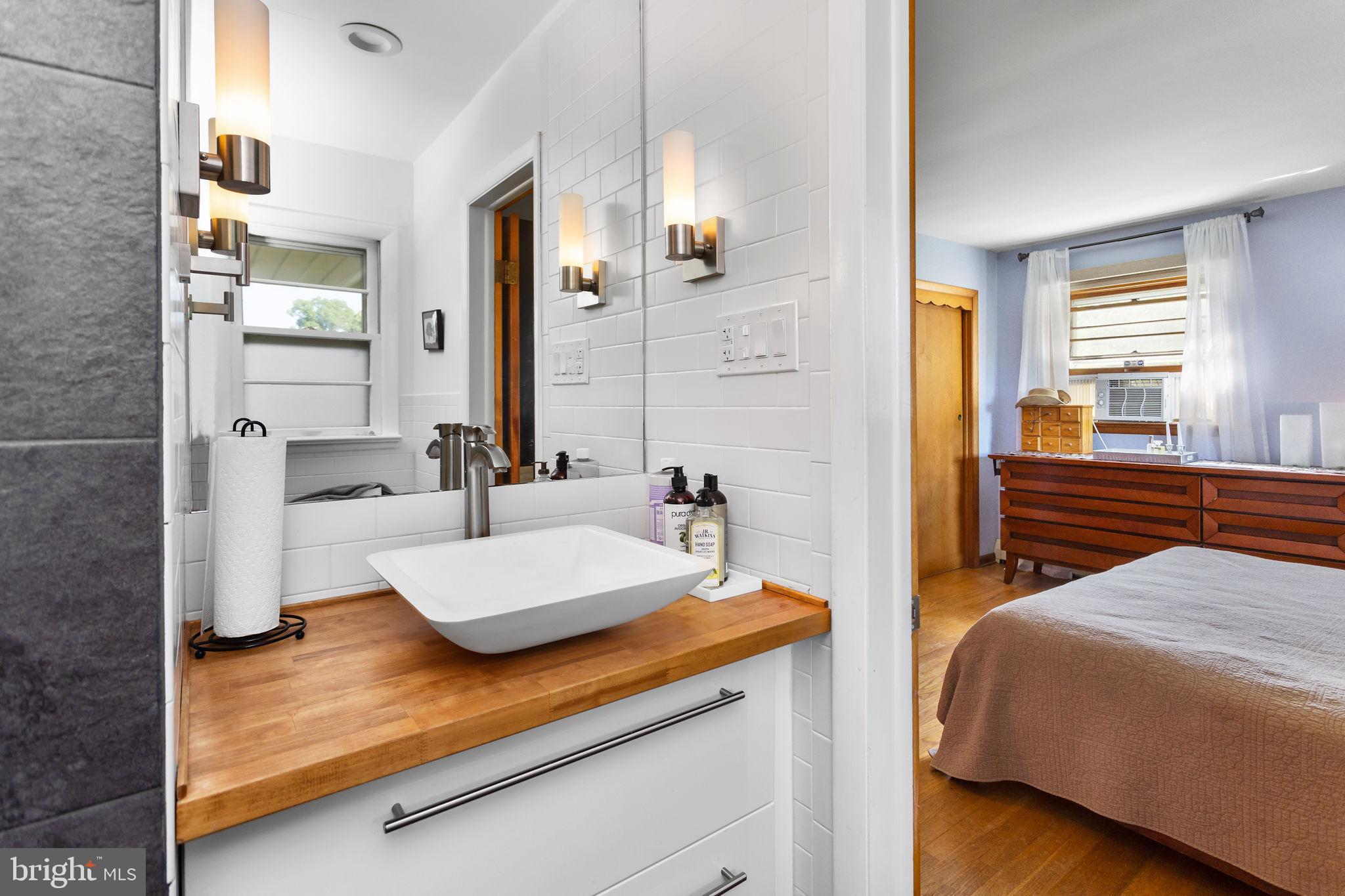 415 Ellisdale Road Chesterfield, NJ 08515 - Photo 23 of 47 a en suite bathroom with a sink and a mirror