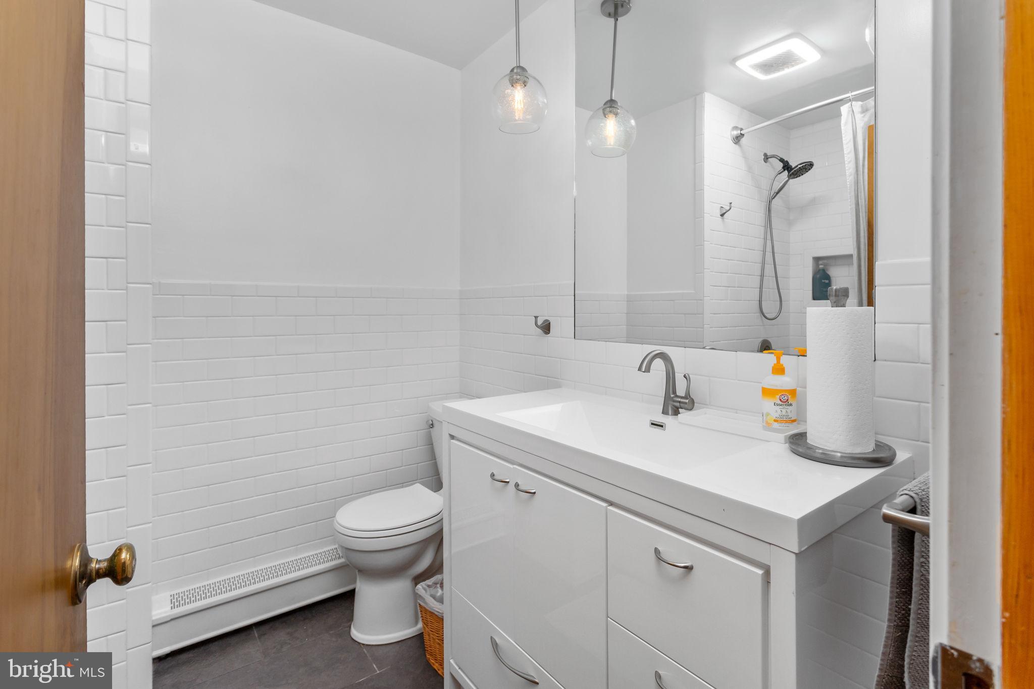 415 Ellisdale Road Chesterfield, NJ 08515 - Photo 25 of 47 a bathroom with a sink a toilet and shower