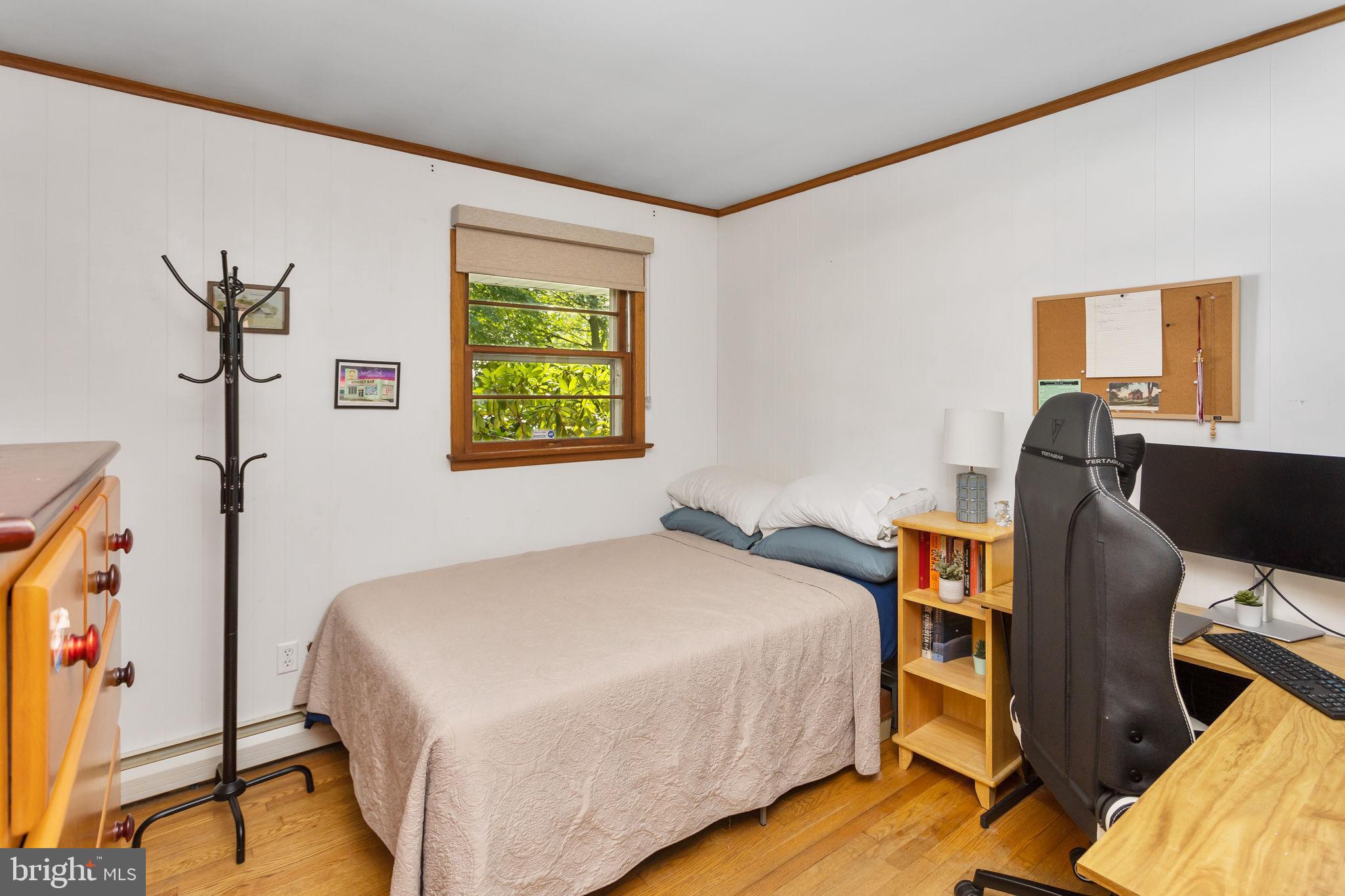 415 Ellisdale Road Chesterfield, NJ 08515 - Photo 26 of 47 a bedroom with a bed and a desk